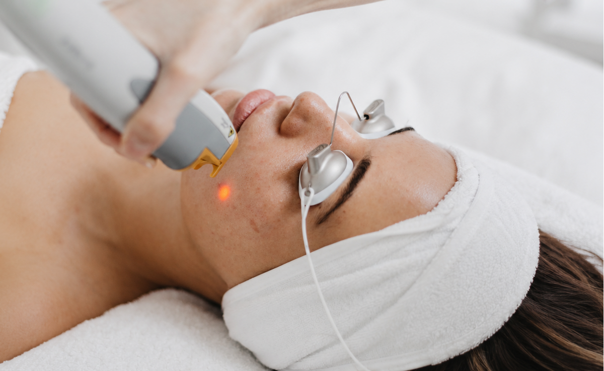 Laser Genesis treatment being performed on a client at About Skin
