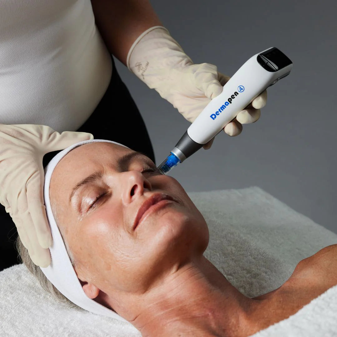 Dermapen microneedling handpiece treating a client's face